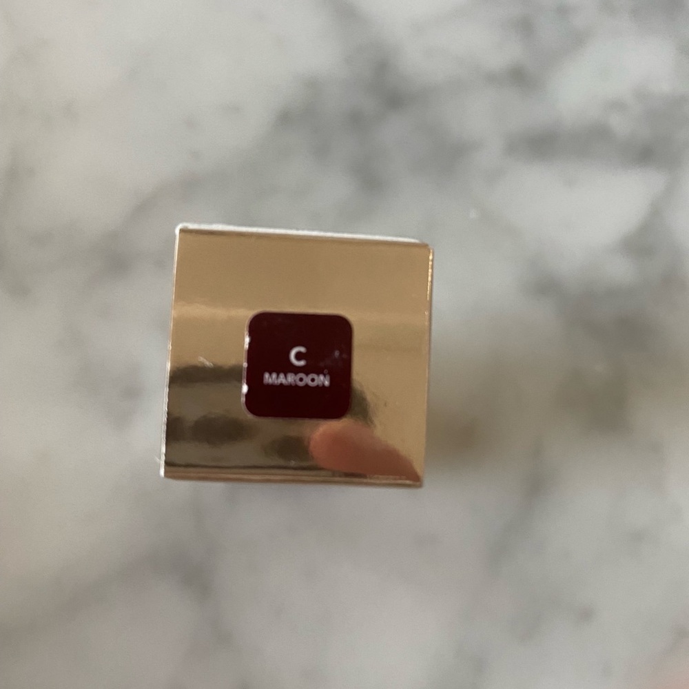 Brand New, Becca Cosmetics lipstick in Maroon